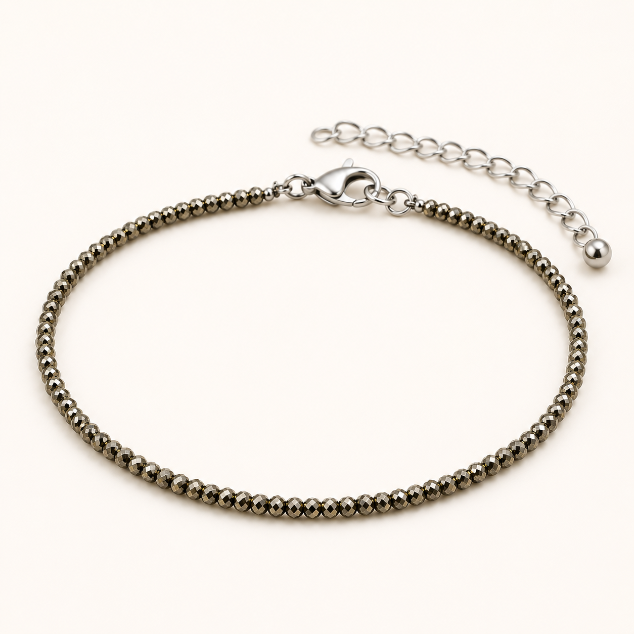 Silver beaded bracelet on a white background
