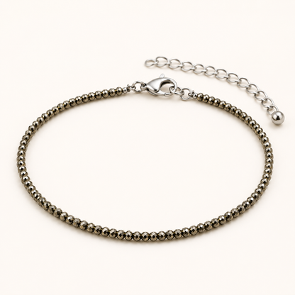 Silver beaded bracelet on a white background